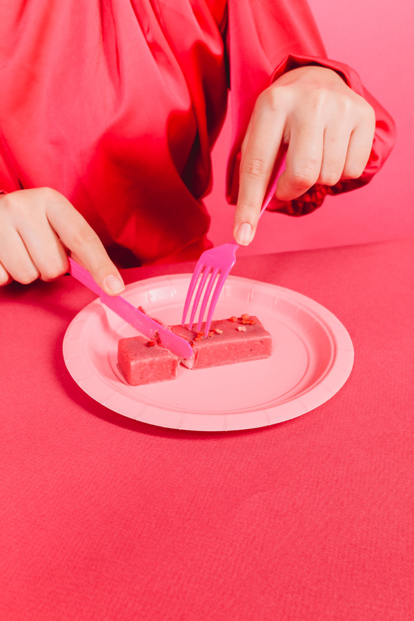 Woman with Slice of Pink Brownie